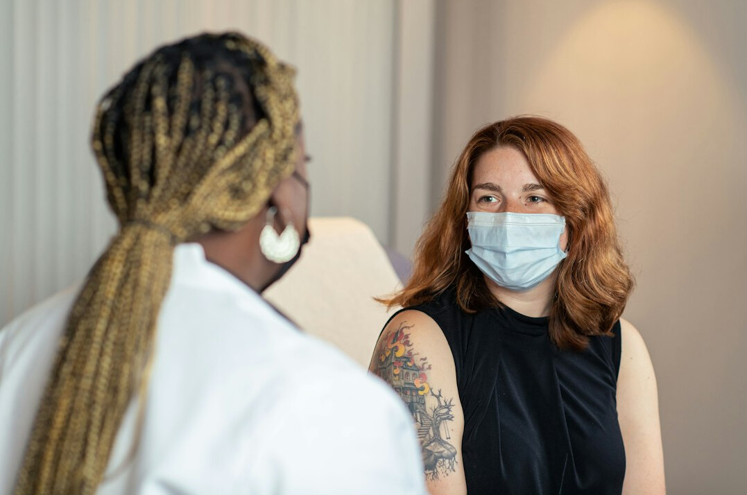 Doctor consulting with a patient about health insurance coverage